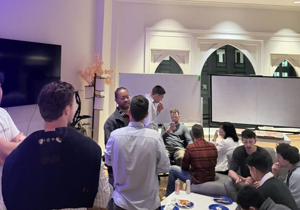Attendees at a Monopoly Money Mondays meetup